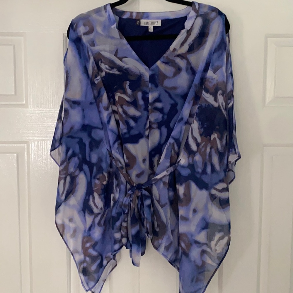 Jennifer Lopez bat winged sleeve top.